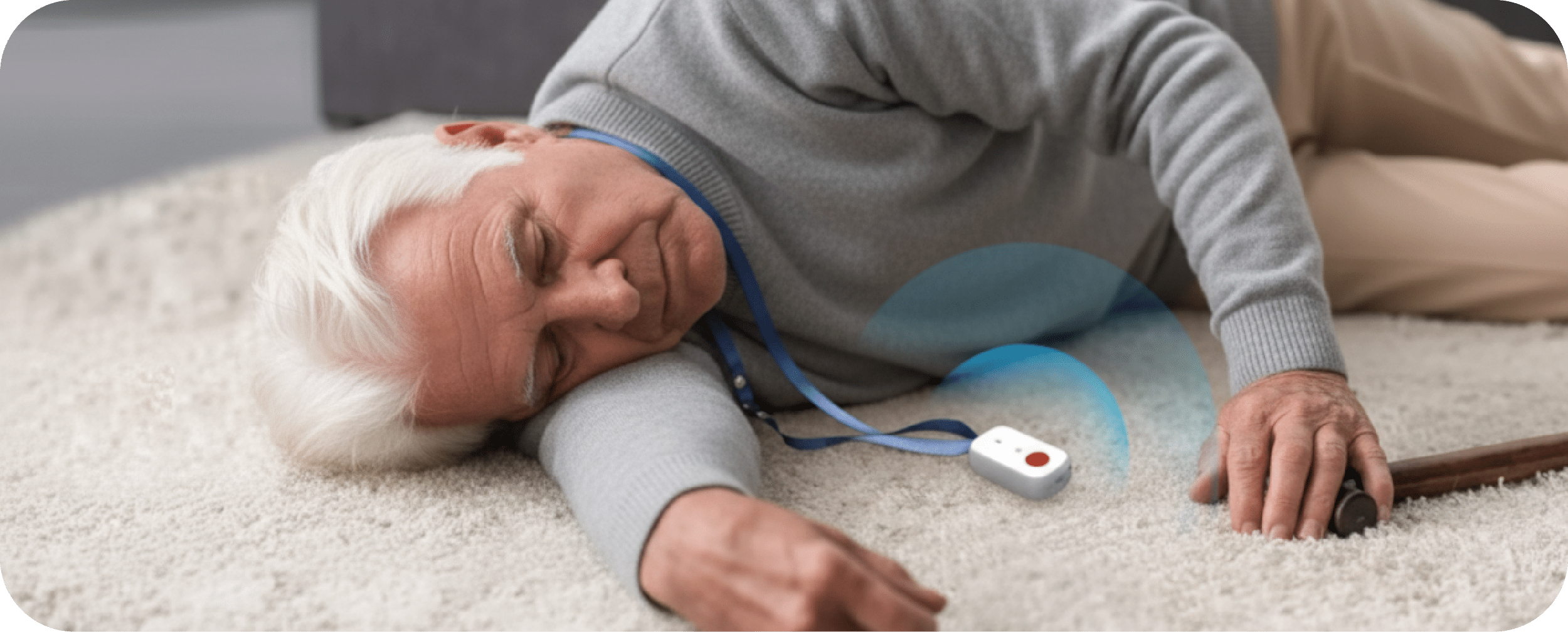 homme-mort Homme âgé allongé au sol, inconscient, avec son pendentif d'alarme médicale déclenchant une alerte.